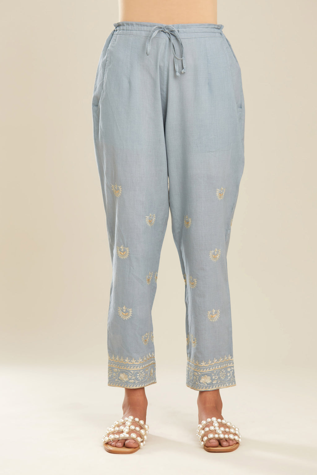 Powder blue cotton narrow pants with gold gota and zari embroidery