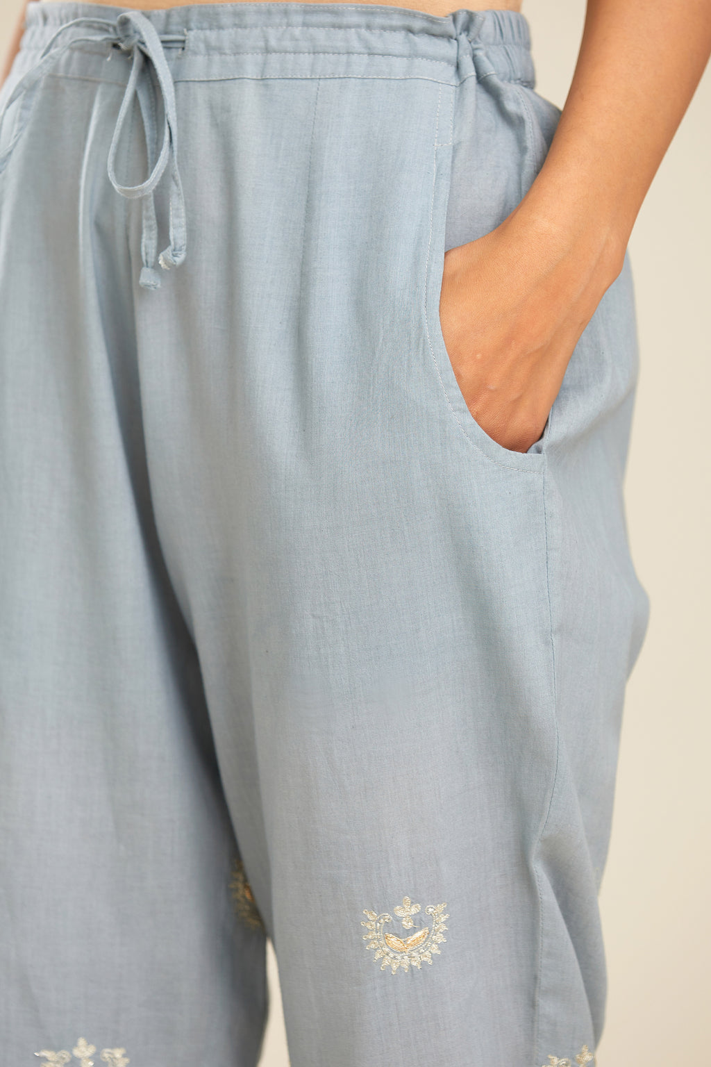 Powder blue cotton narrow pants with gold gota and zari embroidery