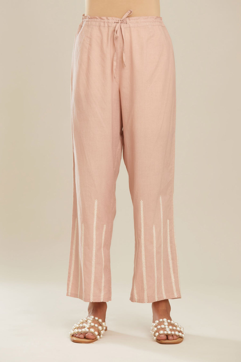 Old rose cotton straight pants with striped embroidery.
