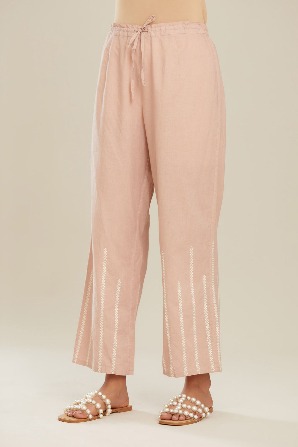 Old rose cotton straight pants with striped embroidery.