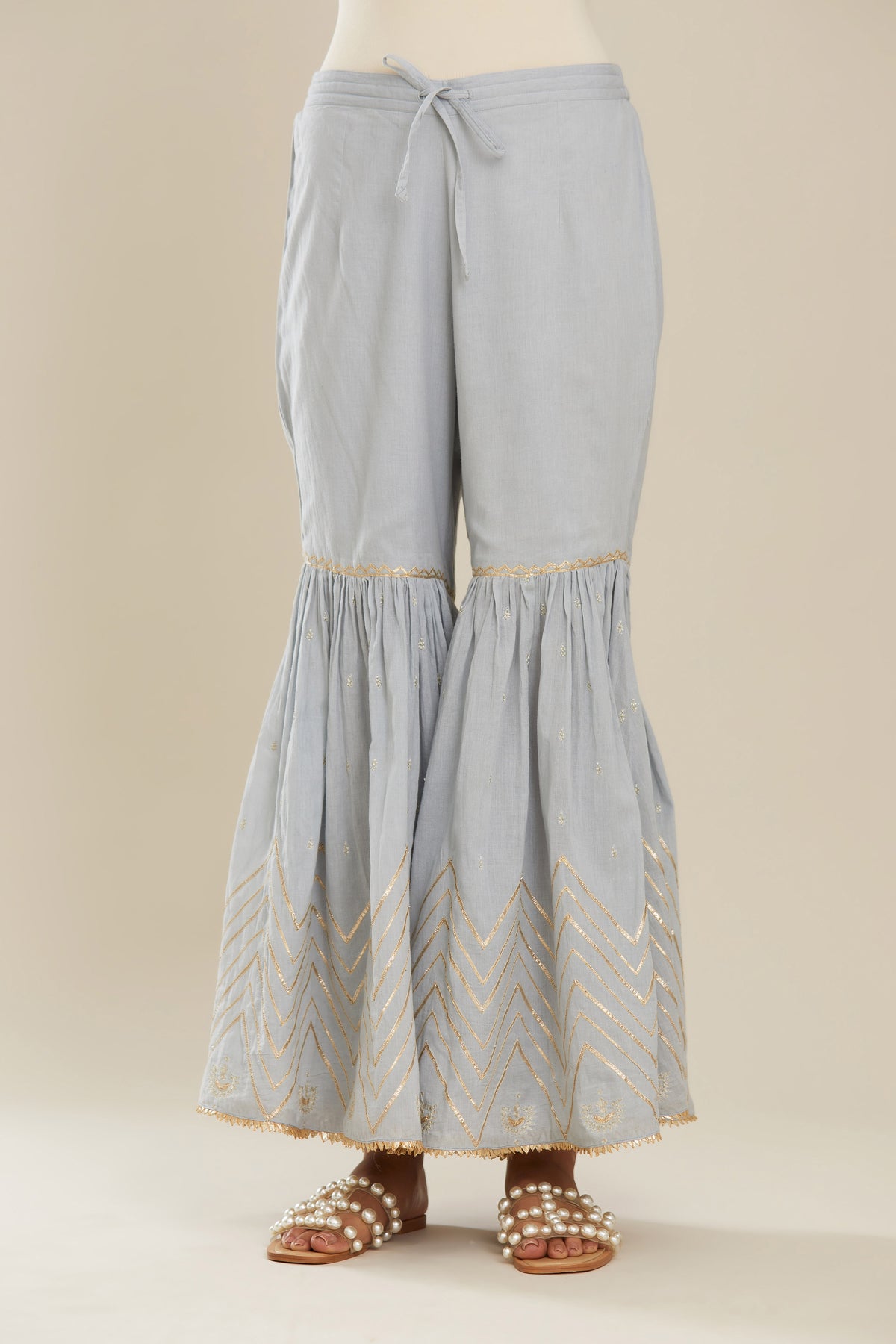 Powder blue farshi with gold gota work and gota patti lace at hem. (Farshi)