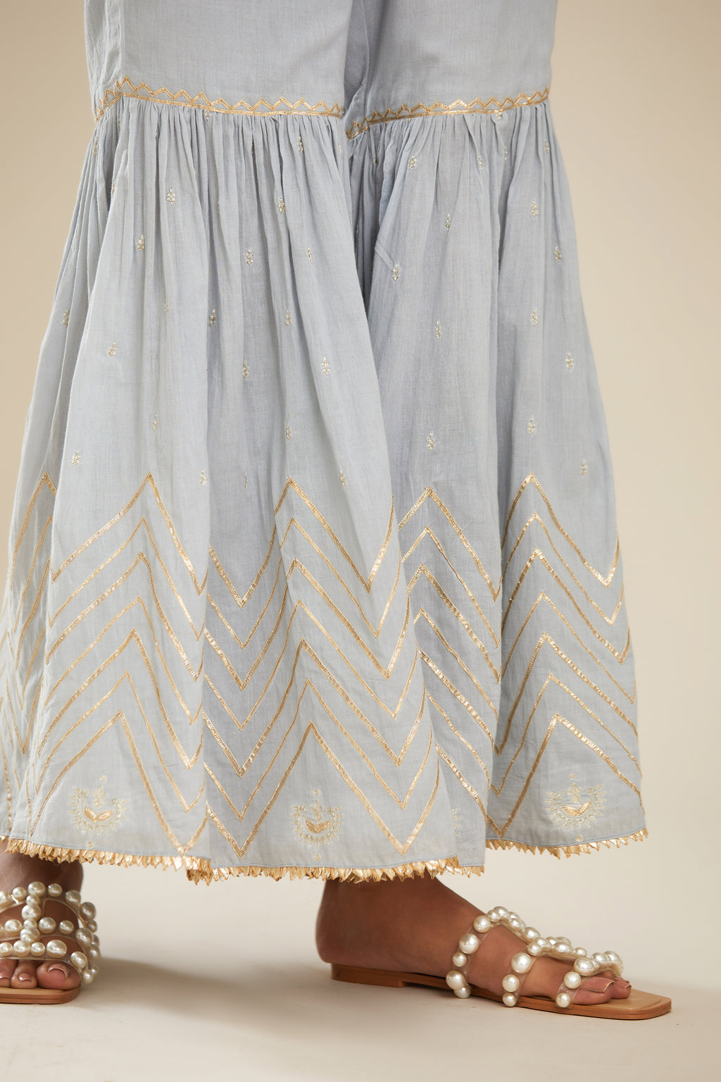 Powder blue farshi with gold gota work and gota patti lace at hem. (Farshi)