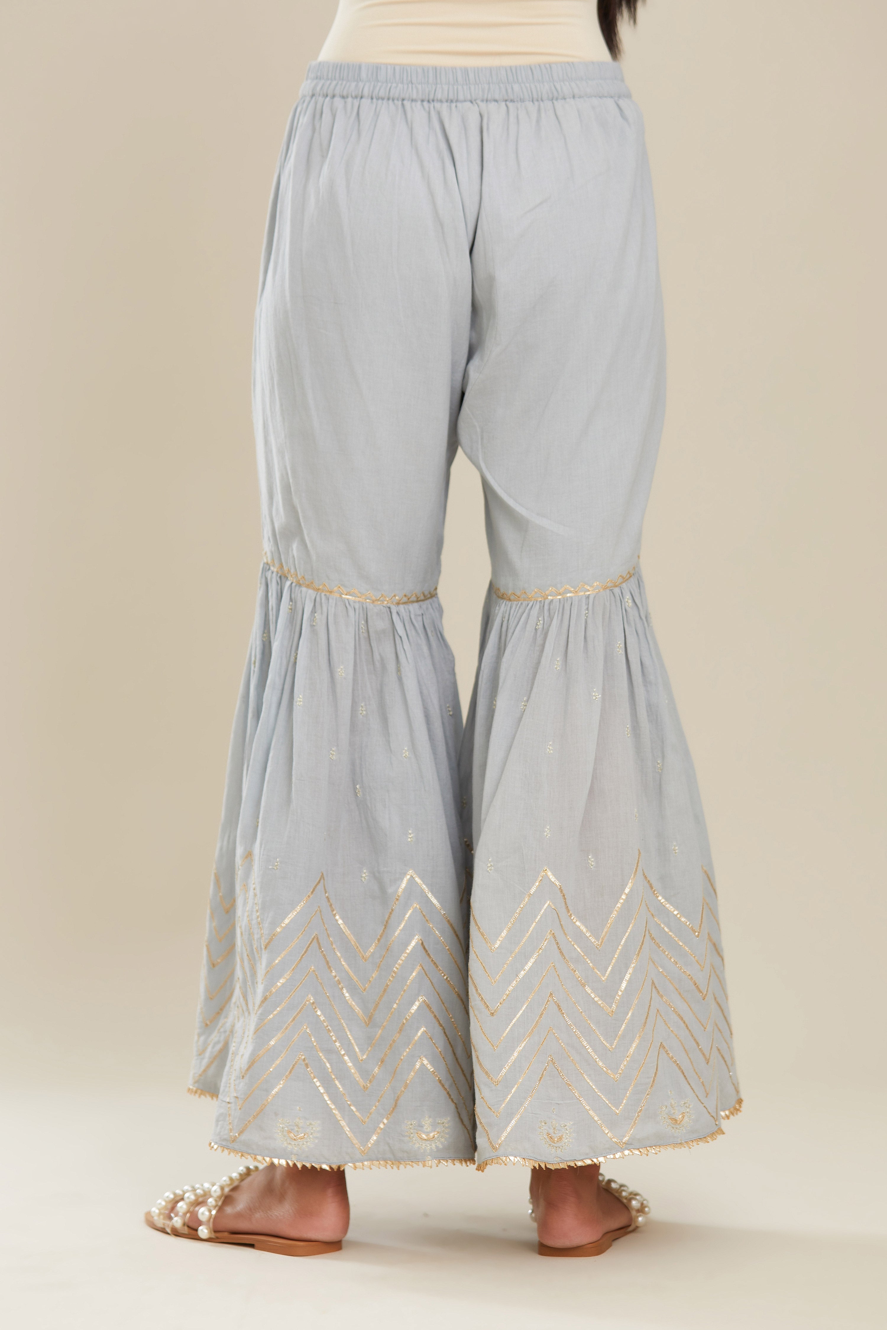 Powder blue farshi with gold gota work and gota patti lace at hem. (Farshi)