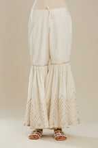 Off white farshi with gold gota work and gota patti lace at hem. (Farshi)