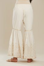 Off white farshi with gold gota work and gota patti lace at hem. (Farshi)