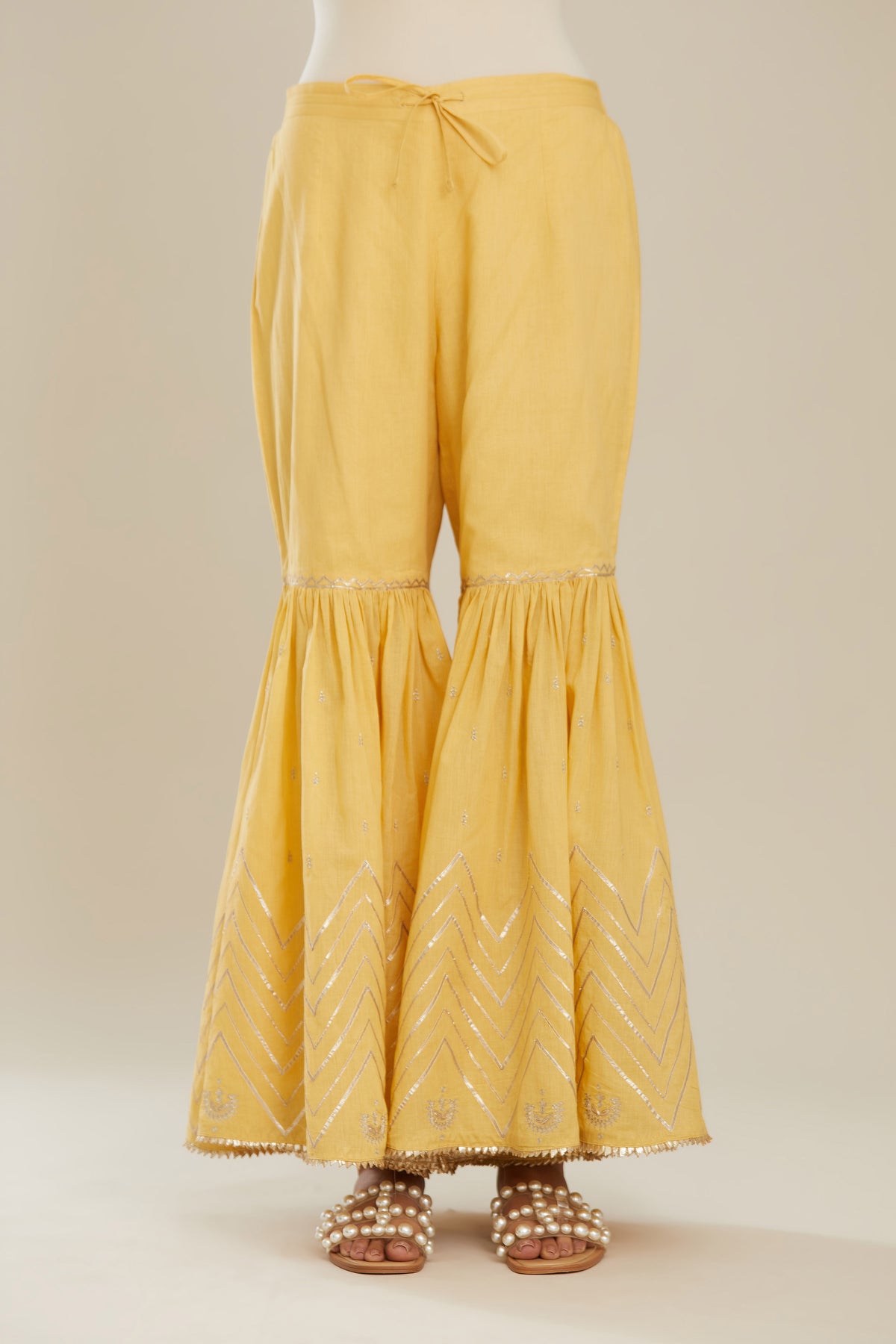 Yellow farshi with gold gota work and gota patti lace at hem. (Farshi)