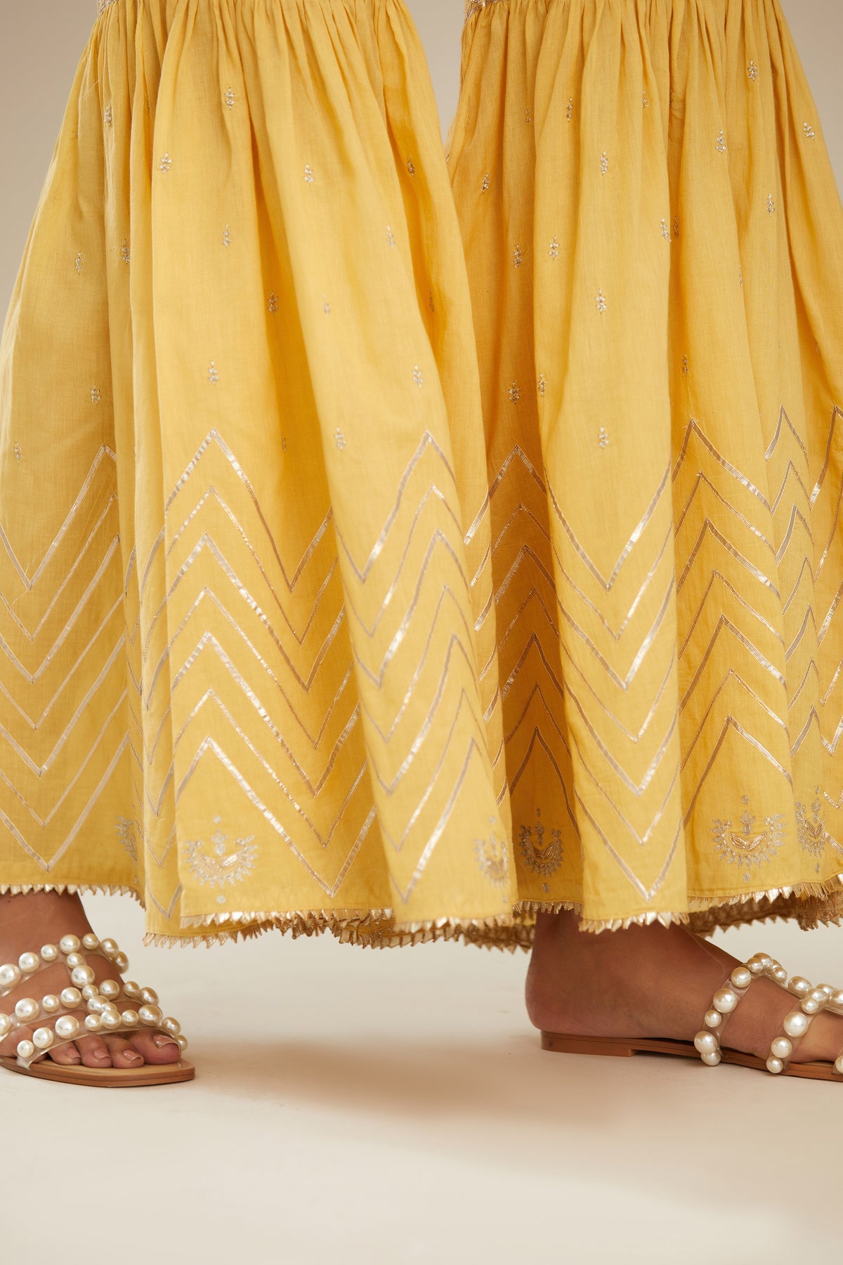 Yellow farshi with gold gota work and gota patti lace at hem. (Farshi)