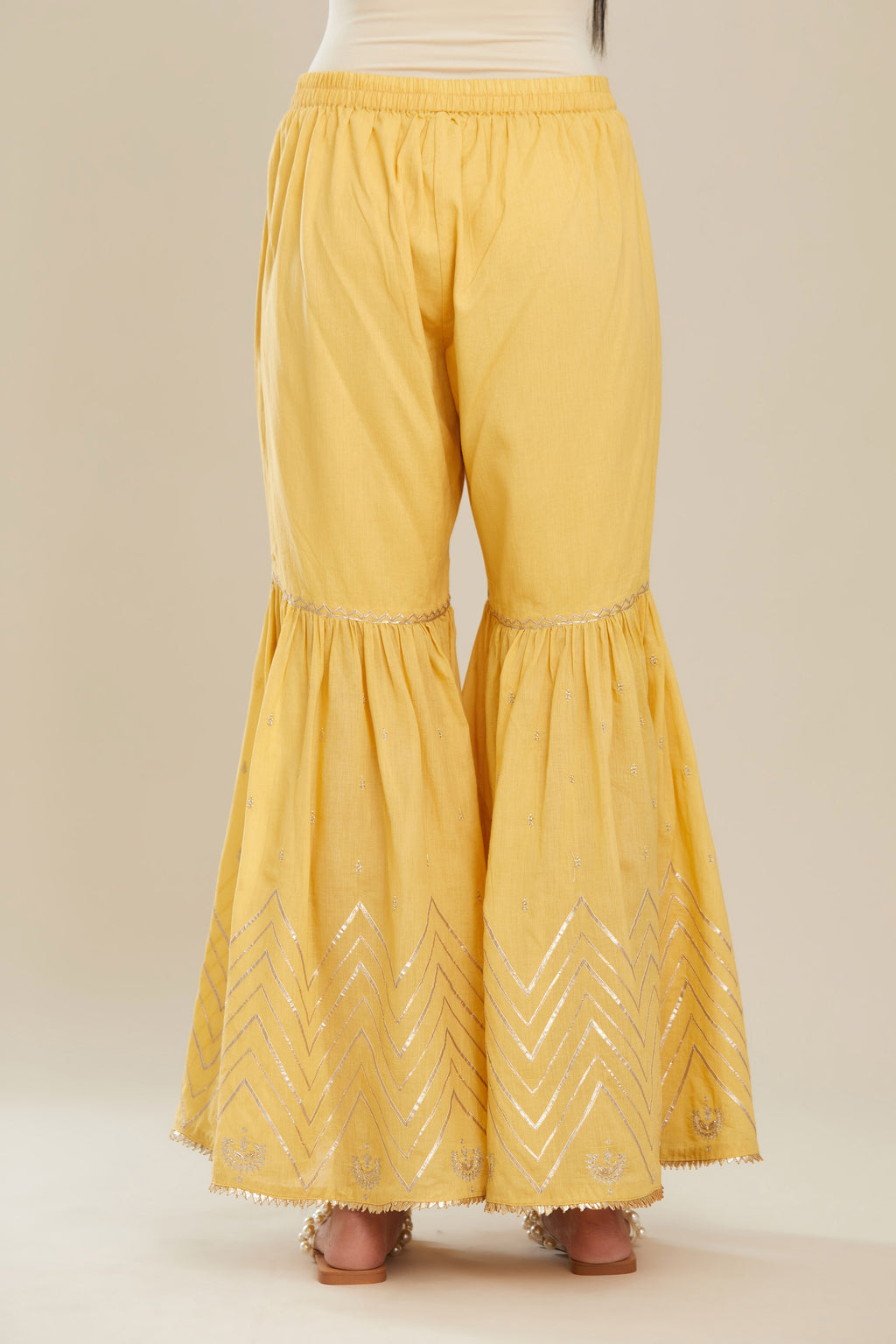 Yellow farshi with gold gota work and gota patti lace at hem. (Farshi)