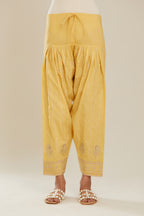 Yellow cotton narrow salwar with all-over gold gota and zari embroidery.