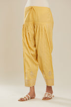 Yellow cotton narrow salwar with all-over gold gota and zari embroidery.