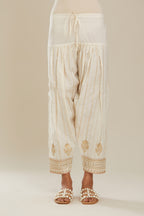 Off white cotton narrow salwar with all-over gold gota and zari embroidery. (Salwar)