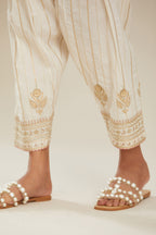 Off white cotton narrow salwar with all-over gold gota and zari embroidery. (Salwar)