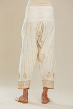 Off white cotton narrow salwar with all-over gold gota and zari embroidery. (Salwar)