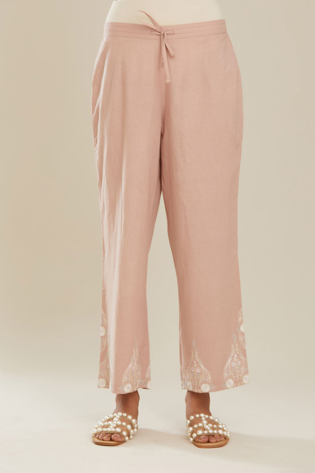 Old rose cotton straight pants with big boota embroidery at hem.