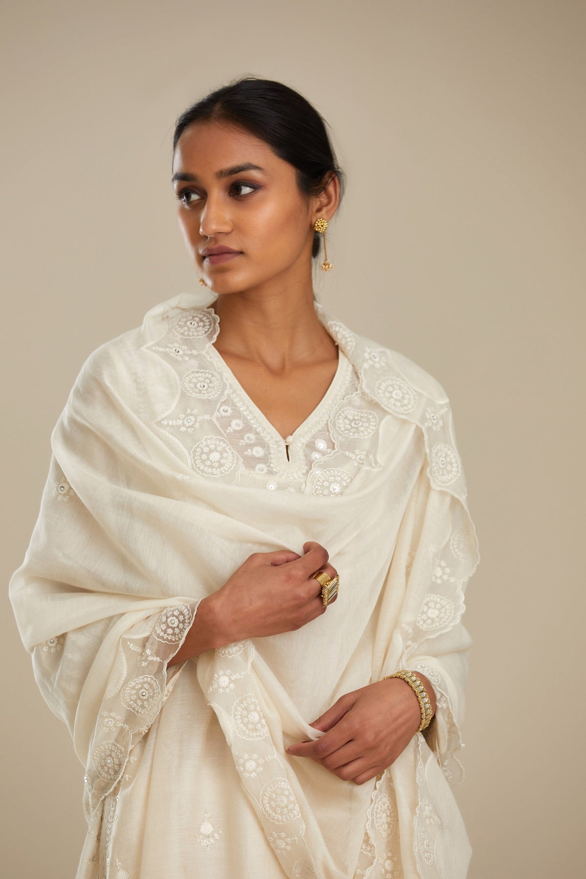 Cotton chanderi easy fit short V neck kurta set with tonal silk thread embroidery, highlighted with sequin and beads.