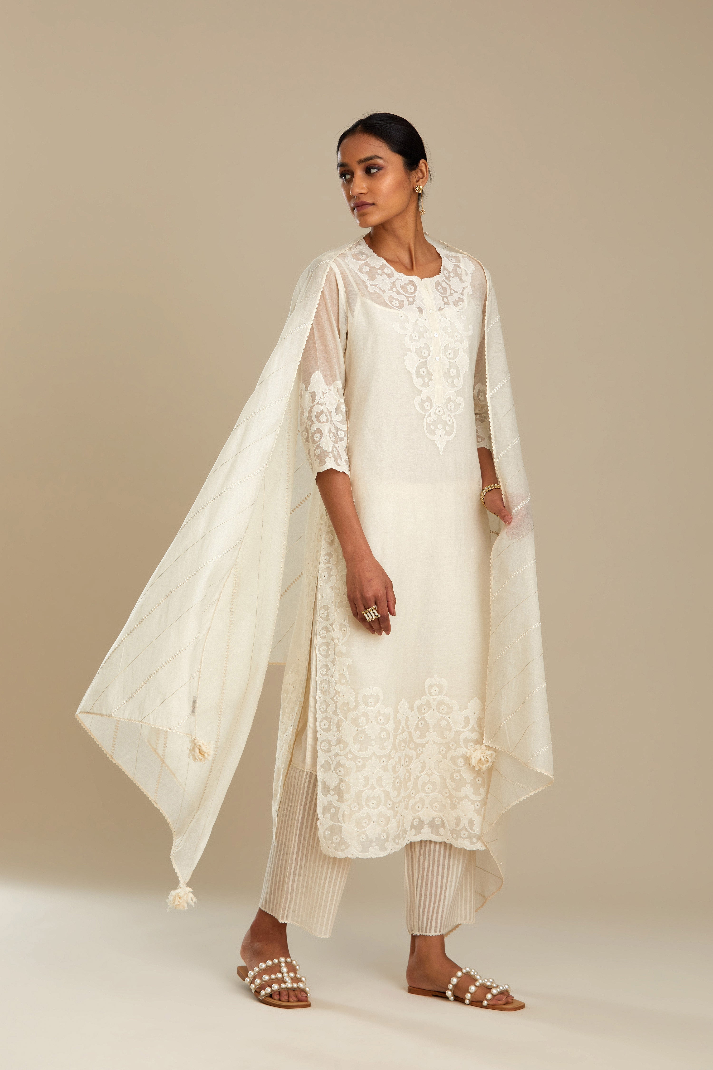 Off white cotton chanderi straight kurta set with cotton appliqué, highlighted with sequins.