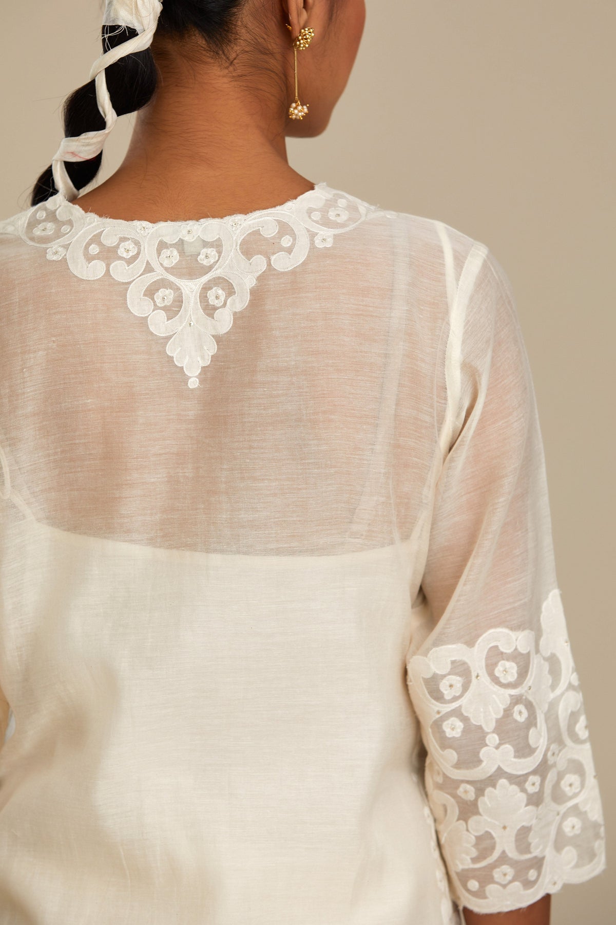 Off white cotton chanderi straight kurta set with cotton appliqué, highlighted with sequins.
