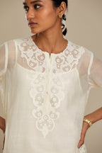Off white cotton chanderi straight kurta set with cotton appliqué, highlighted with sequins.