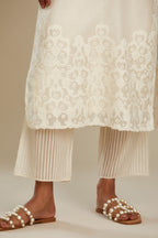 Off white cotton chanderi straight kurta set with cotton appliqué, highlighted with sequins.