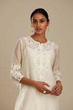 Off white cotton chanderi straight kurta set with cotton appliqué, highlighted with sequins.