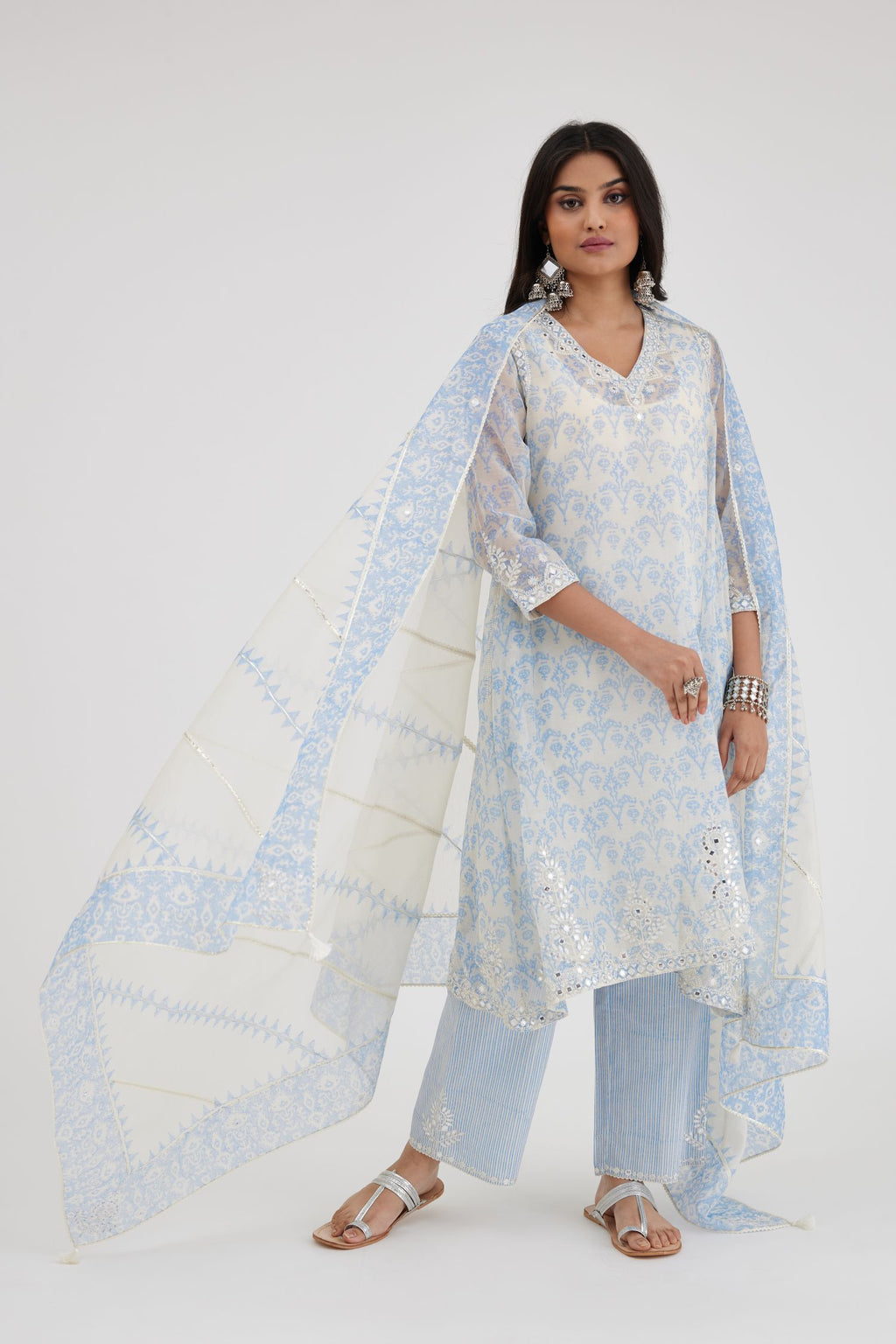 Blue and off white cotton chanderi Ikat design hand-block printed A-line short kurta set with V-neck and asymmetric hem.