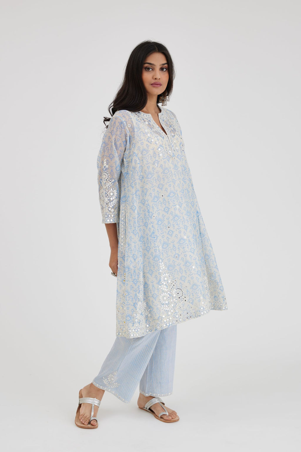 Ikat design blue and off white hand block-printed Cotton Chanderi short panelled kurta set with off-white thread and mirror embroidery.
