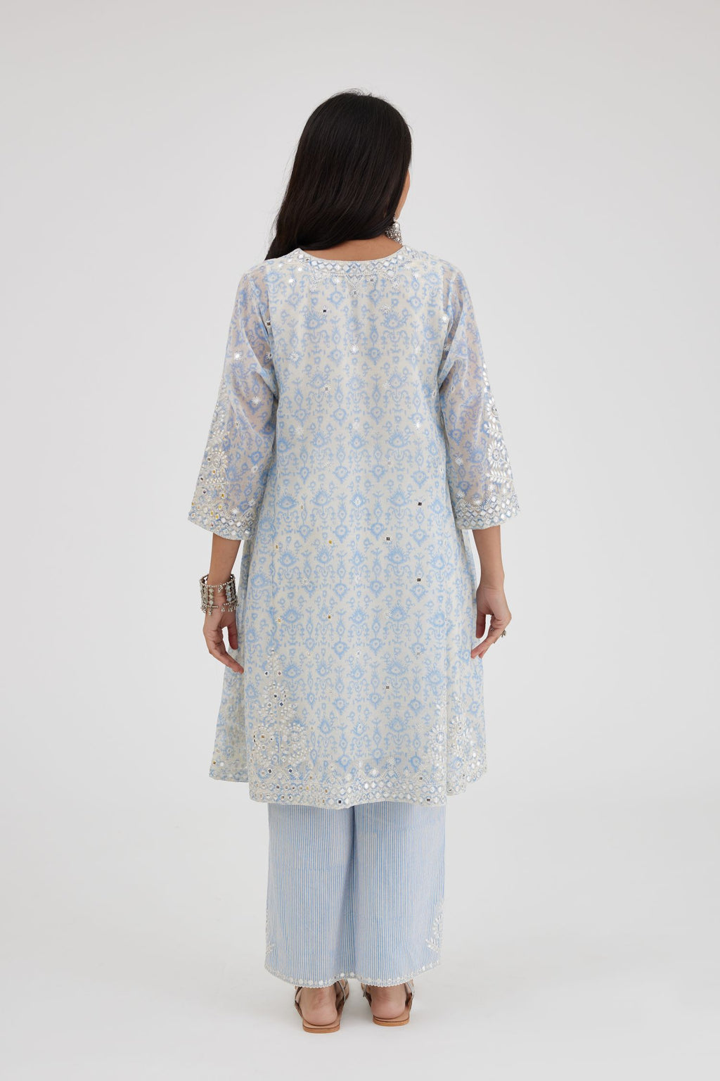 Ikat design blue and off white hand block-printed Cotton Chanderi short panelled kurta set with off-white thread and mirror embroidery.