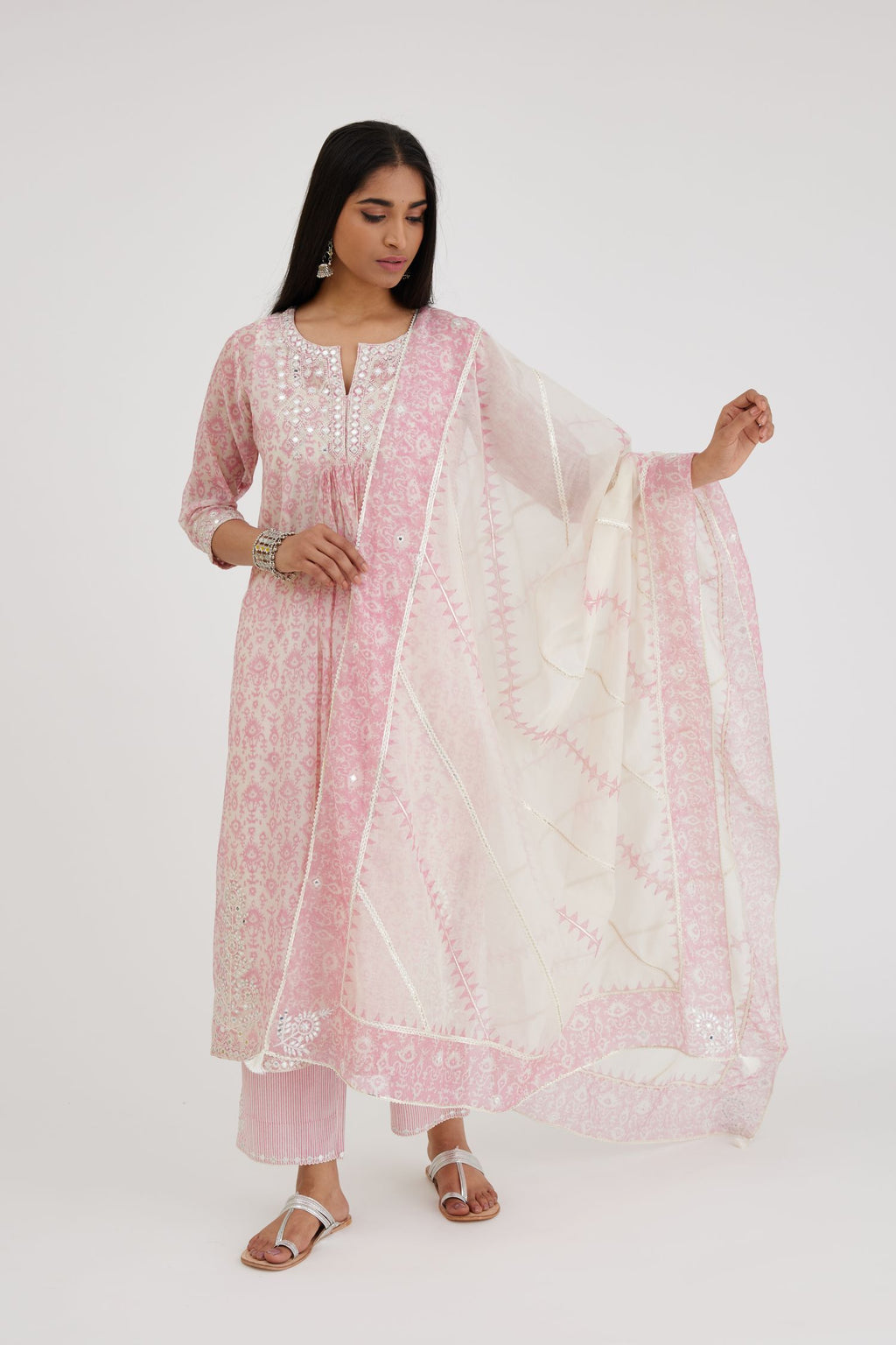 Ikat design pink and off white hand block-printed Cotton Chanderi straight long kurta set dress with off-white thread and mirror embroidery.