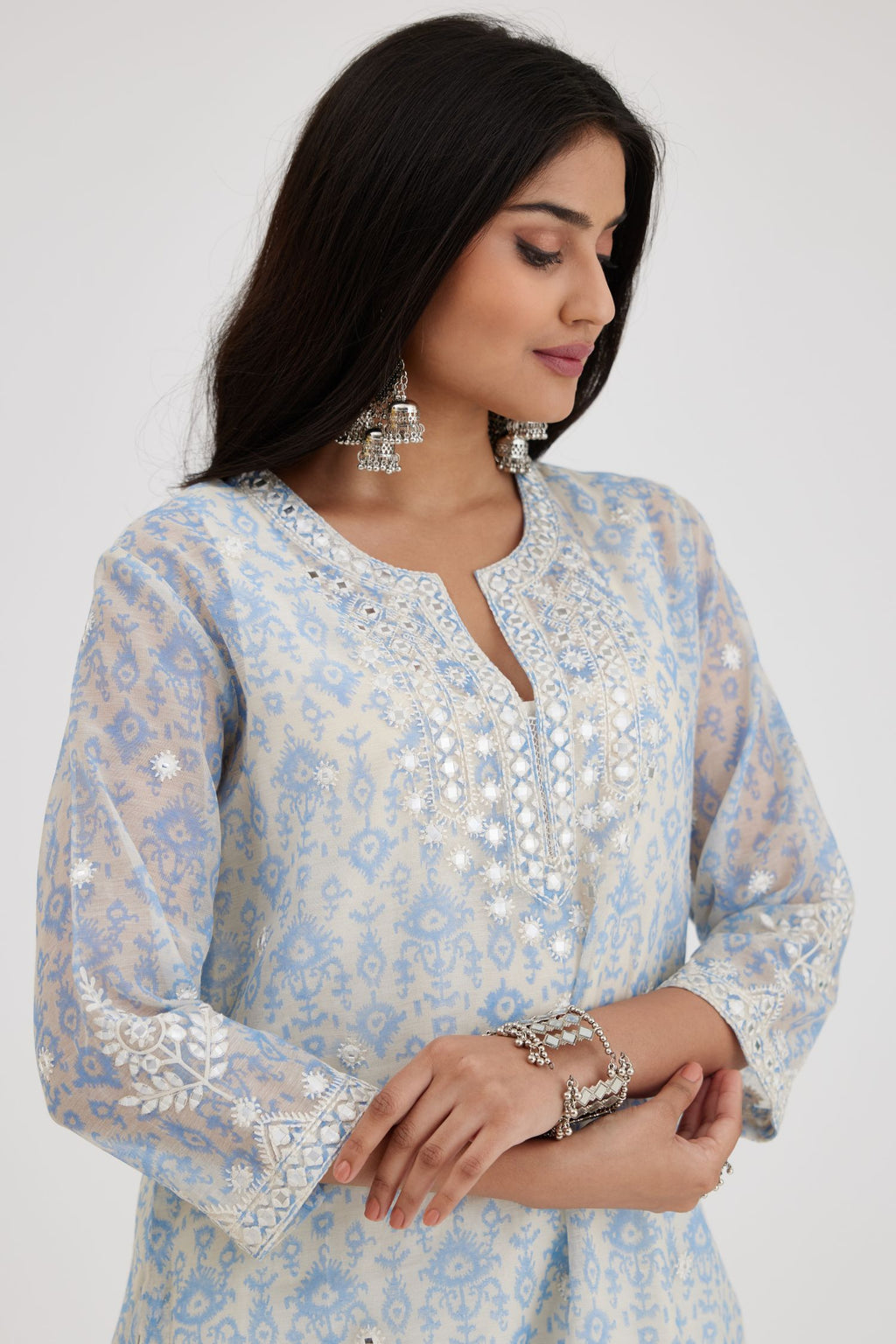 Ikat design blue and off white hand block-printed Cotton Chanderi straight long kurta set with round neck, highlighted with off-white thread and mirror embroidery.