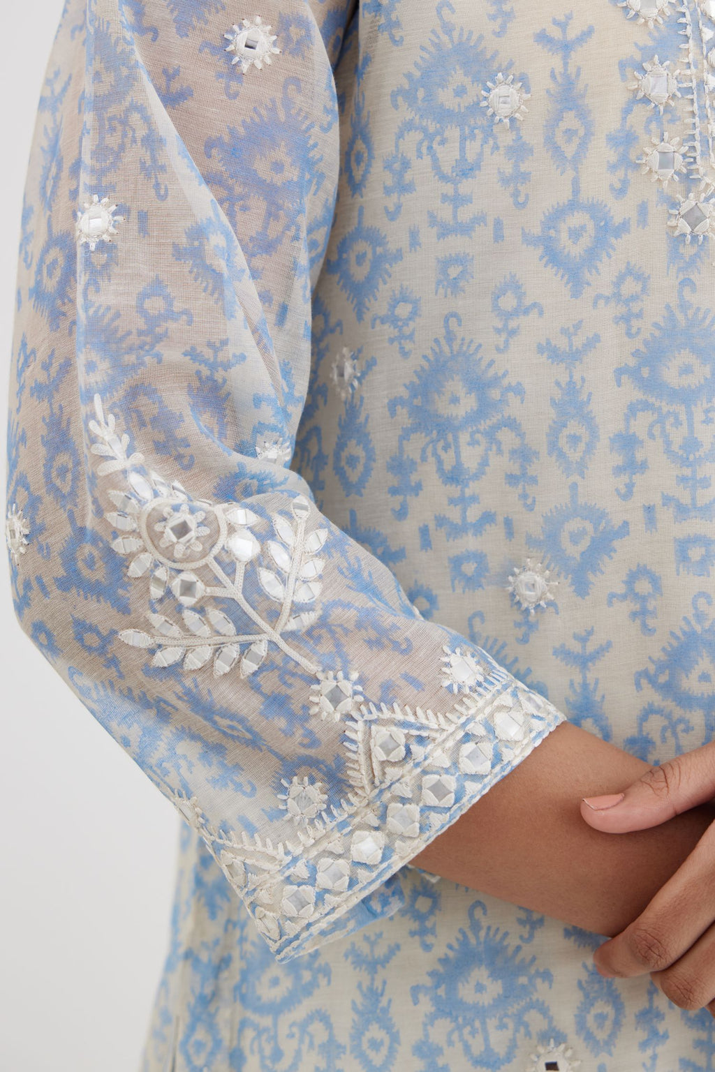 Ikat design blue and off white hand block-printed Cotton Chanderi straight long kurta set with round neck, highlighted with off-white thread and mirror embroidery.