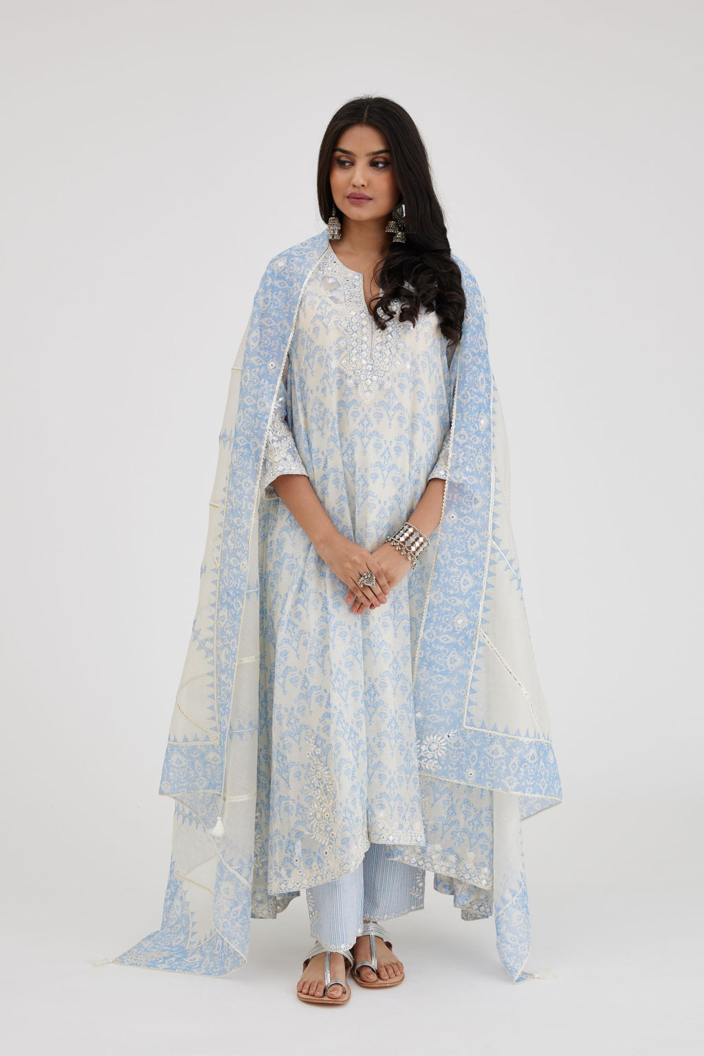 Ikat design blue and off white hand block-printed Cotton Chanderi panelled and asymmetric hem long kurta set with off-white thread and mirror embroidery.