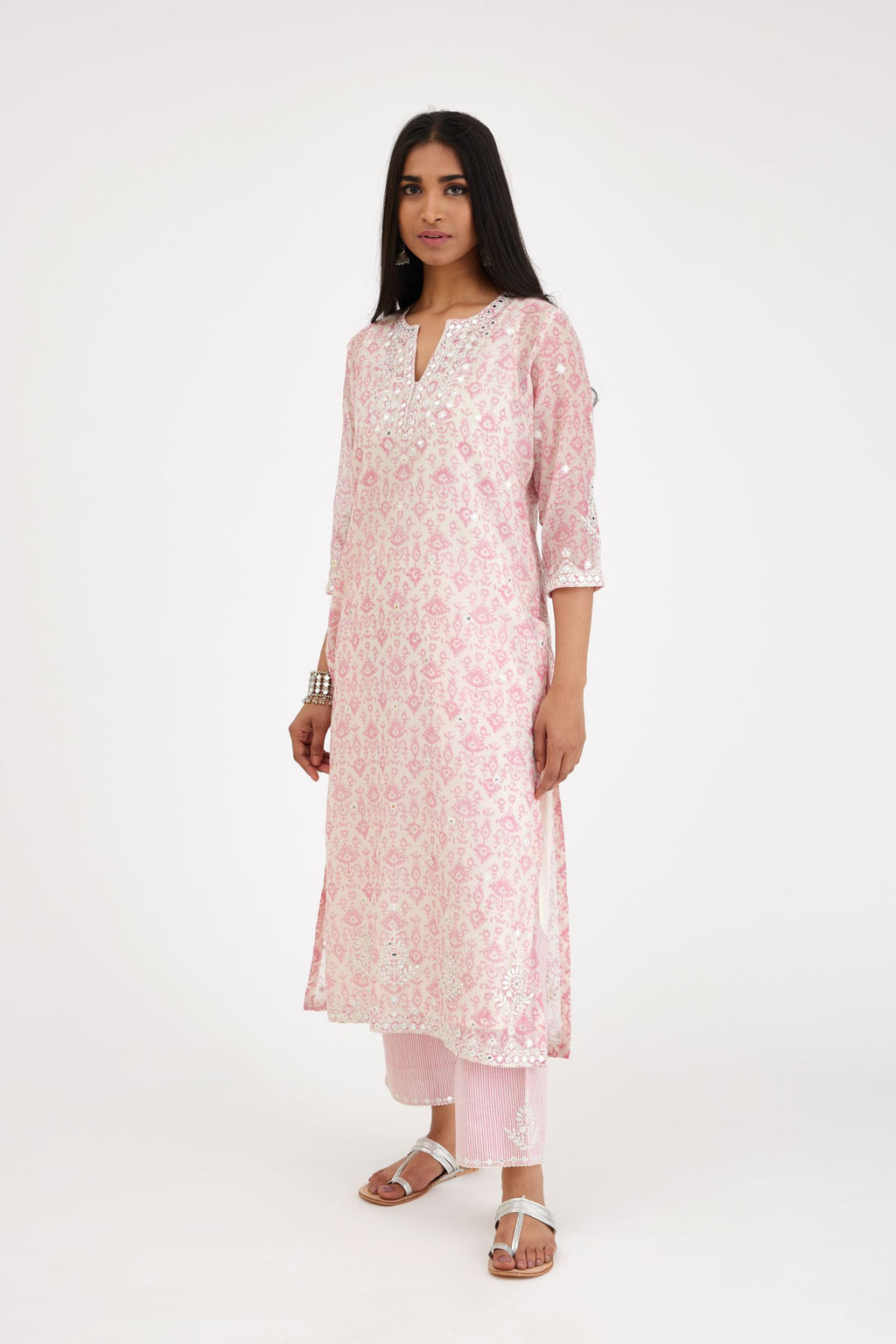 Ikat design pink and off white hand block-printed Cotton Chanderi straight long kurta set with round neck, highlighted with off-white thread and mirror embroidery.