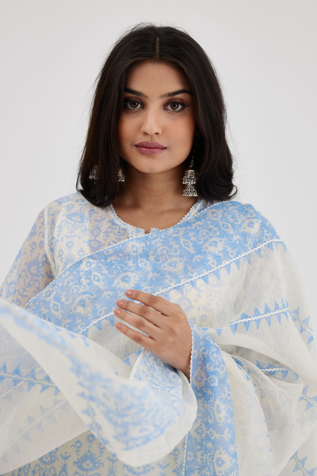 Ikat design blue and off white hand block-printed Cotton Chanderi straight long kurta set with round neck and front button placket.