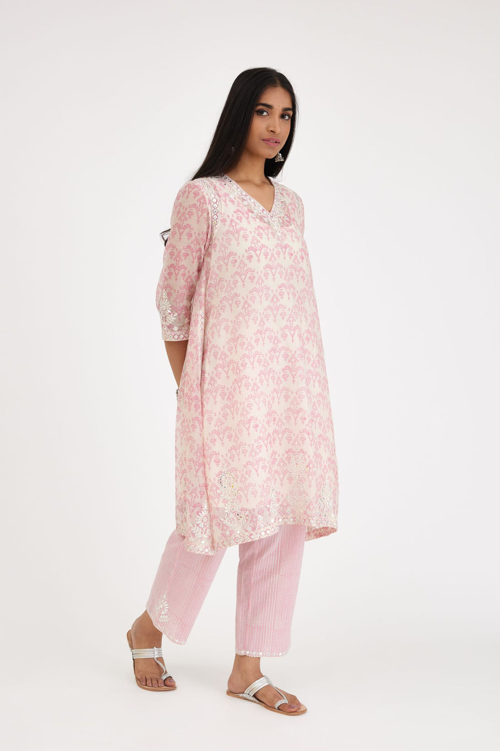 Pink and off white cotton chanderi Ikat design hand-block printed A-line short kurta set with V-neck and asymmetric hem.