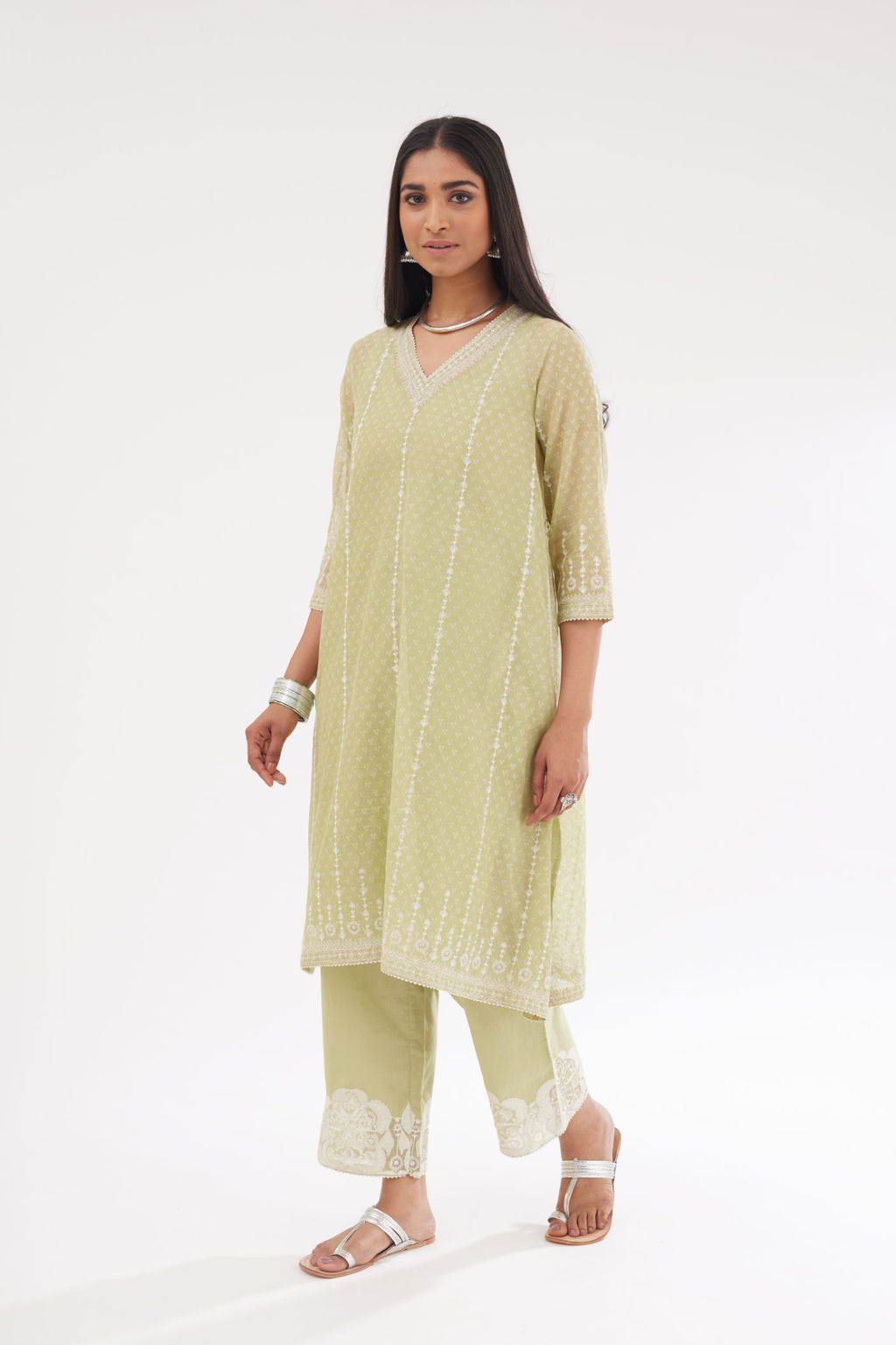 Green hand block printed cotton chanderi A-line short kurta set with all over delicate dori and silk thread embroidery stripes.