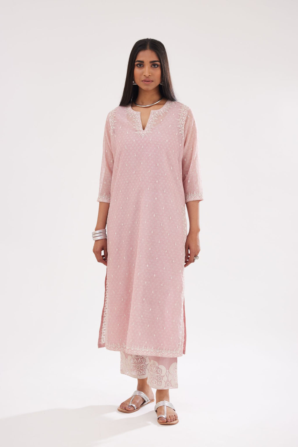 Pink cotton chanderi hand block printed kurta set with dori and silk thread embroidery at the neck, armholes, hem and sleeve cuffs.