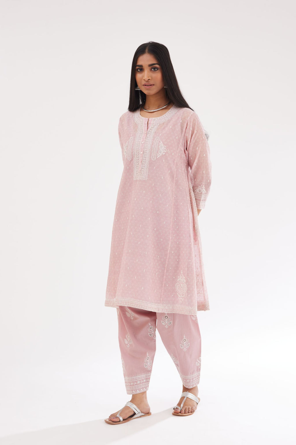 Pink cotton chanderi hand block printed short kalidar phiran style kurta set with button placket neckline and dori and silk thraed embroidery all over.