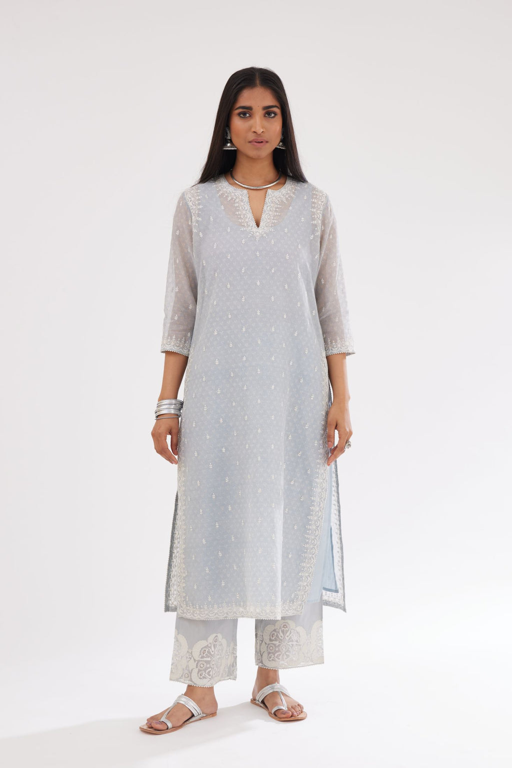 Blue cotton chanderi hand block printed kurta set with dori and silk thread embroidery at the neck, armholes, hem and sleeve cuffs.