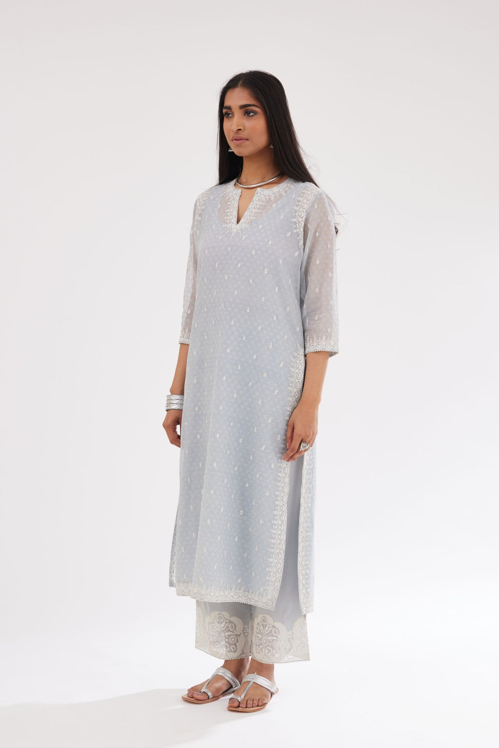 Blue cotton chanderi hand block printed kurta set with dori and silk thread embroidery at the neck, armholes, hem and sleeve cuffs.