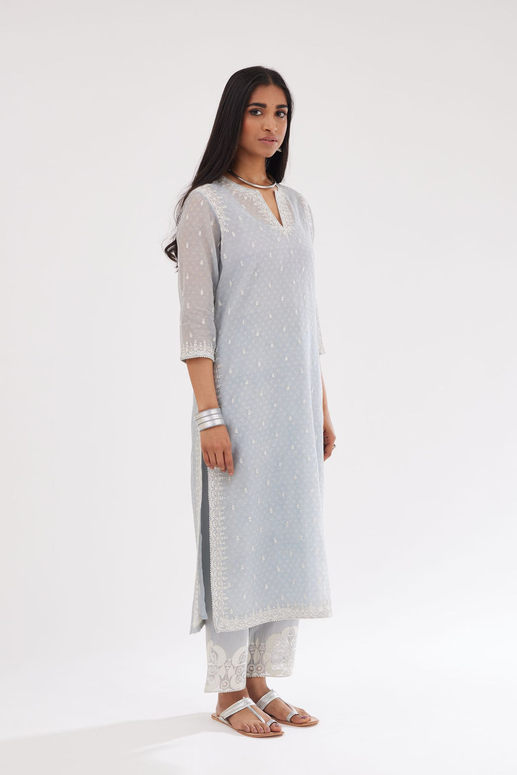 Blue cotton chanderi hand block printed kurta set with dori and silk thread embroidery at the neck, armholes, hem and sleeve cuffs.