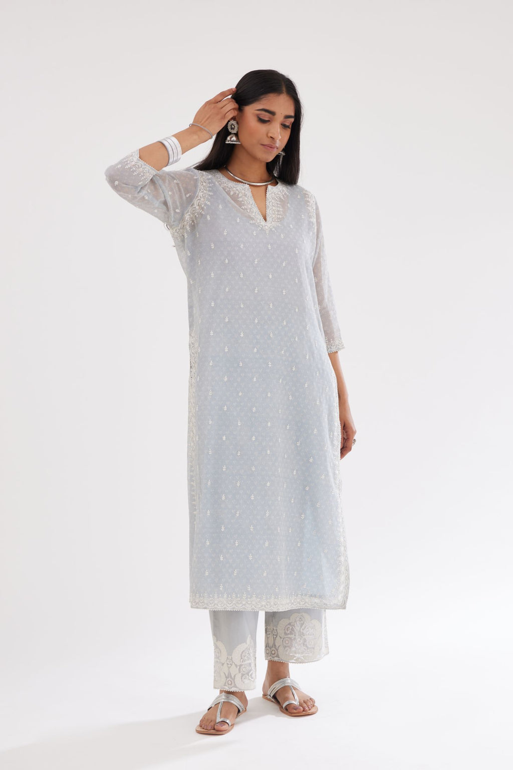 Blue cotton chanderi hand block printed kurta set with dori and silk thread embroidery at the neck, armholes, hem and sleeve cuffs.