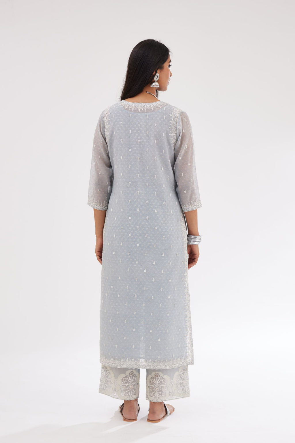 Blue cotton chanderi hand block printed kurta set with dori and silk thread embroidery at the neck, armholes, hem and sleeve cuffs.