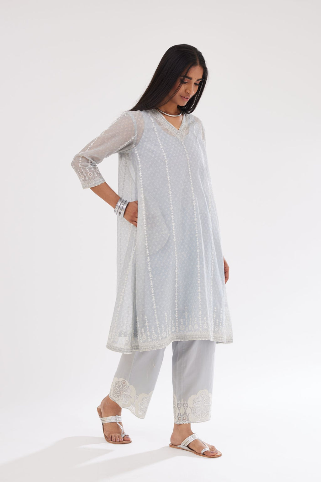 Blue hand block printed cotton chanderi A-line short kurta set with all over delicate dori and silk thread embroidery stripes.