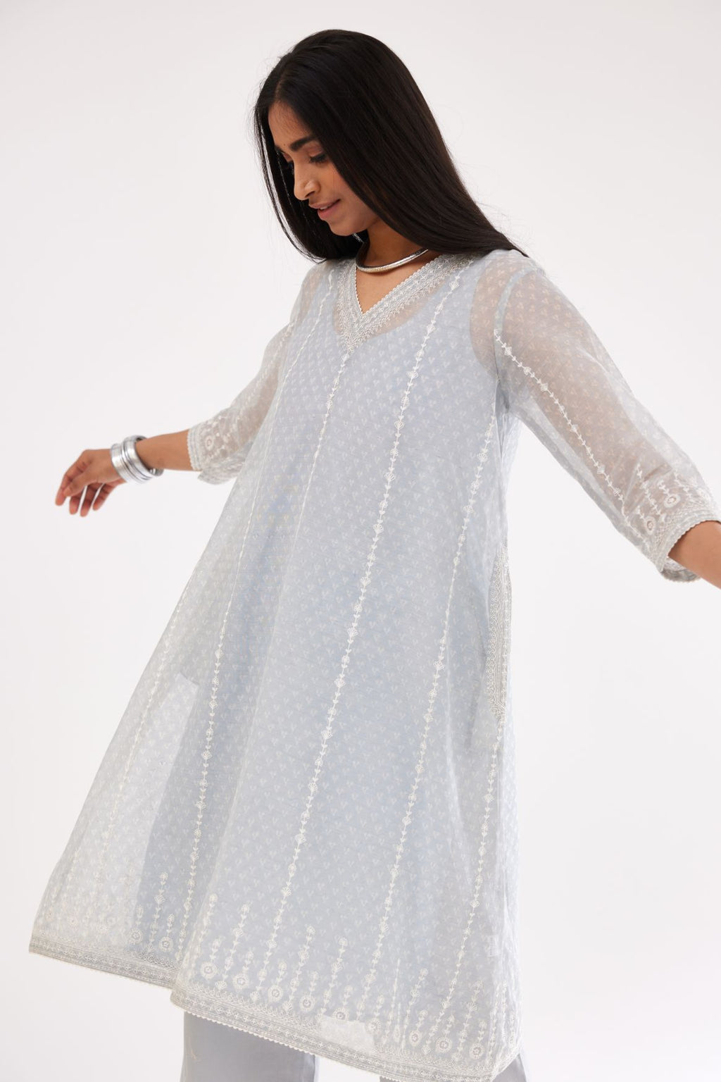 Blue hand block printed cotton chanderi A-line short kurta set with all over delicate dori and silk thread embroidery stripes.