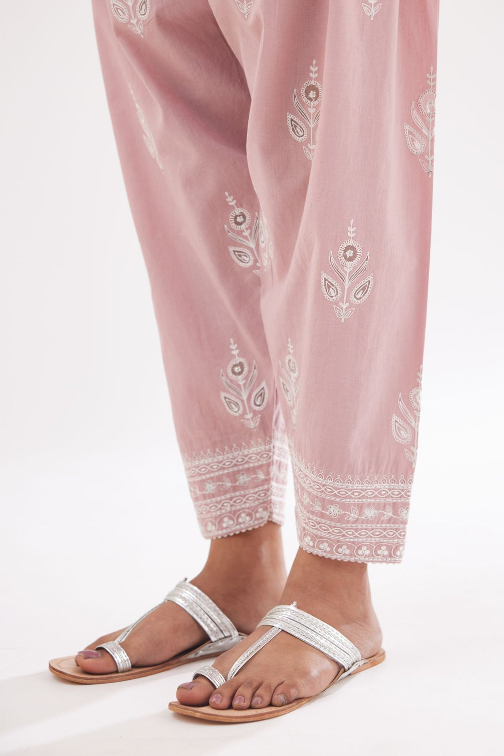 Pink cotton narrow salwar with all-over dori and silk thread embroidery.