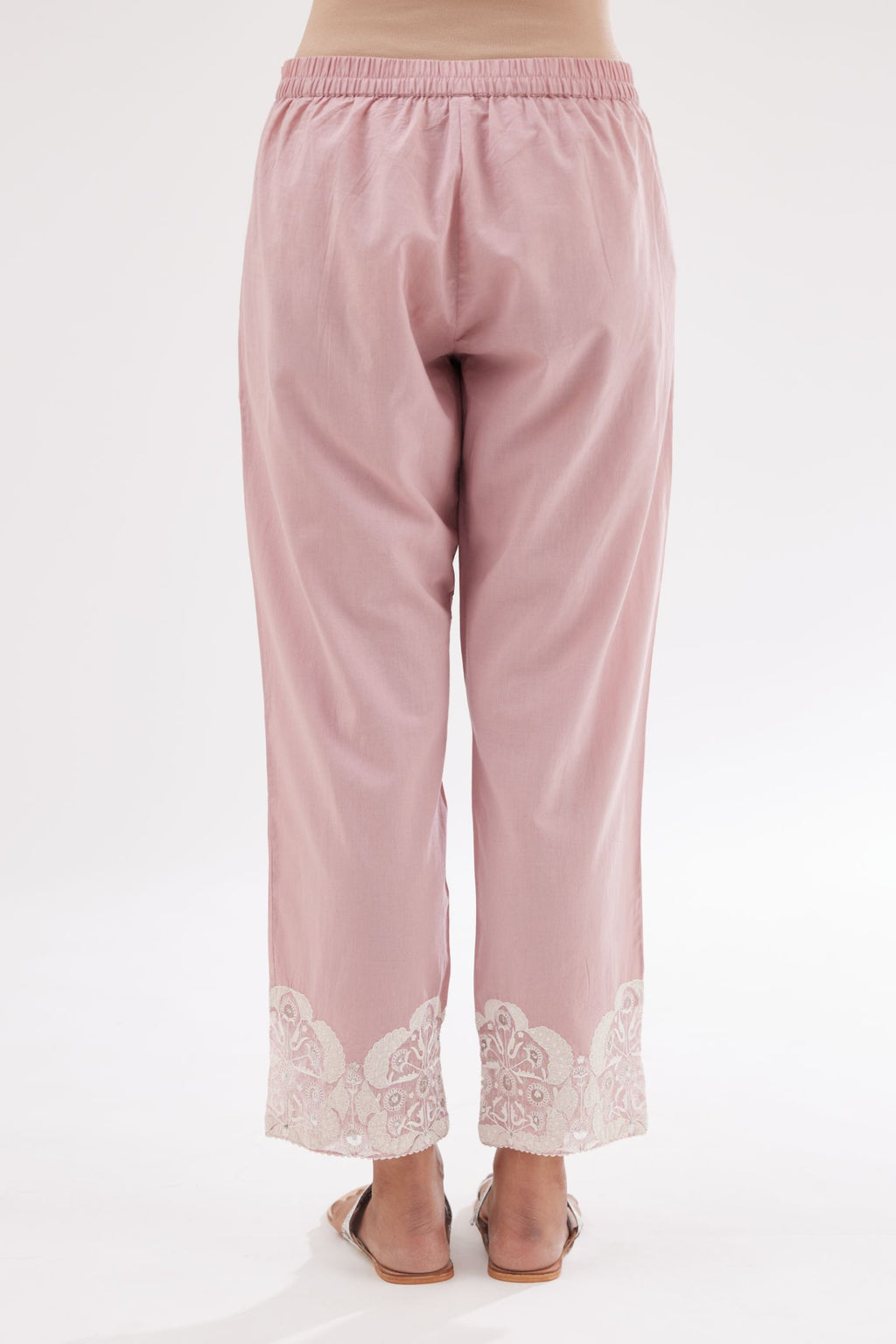 Pink cotton straight pants with appliqué and hand attached sequins detailing at bottom hem.