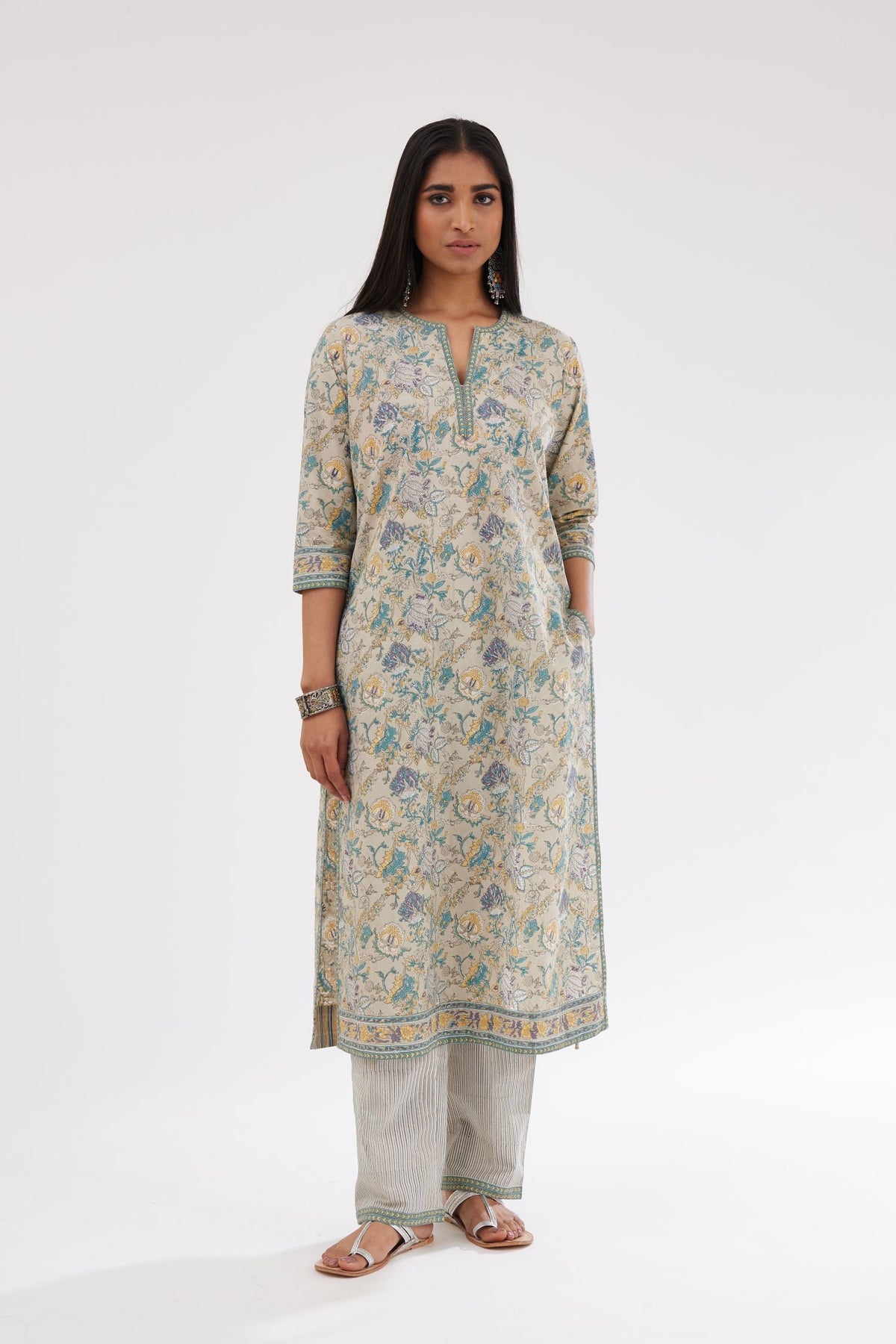 Grey and blue straight kurta with all-over chintz block print & side slits, paired with grey and blue printed stripe cotton straight pants with a narrow printed border at the hem.