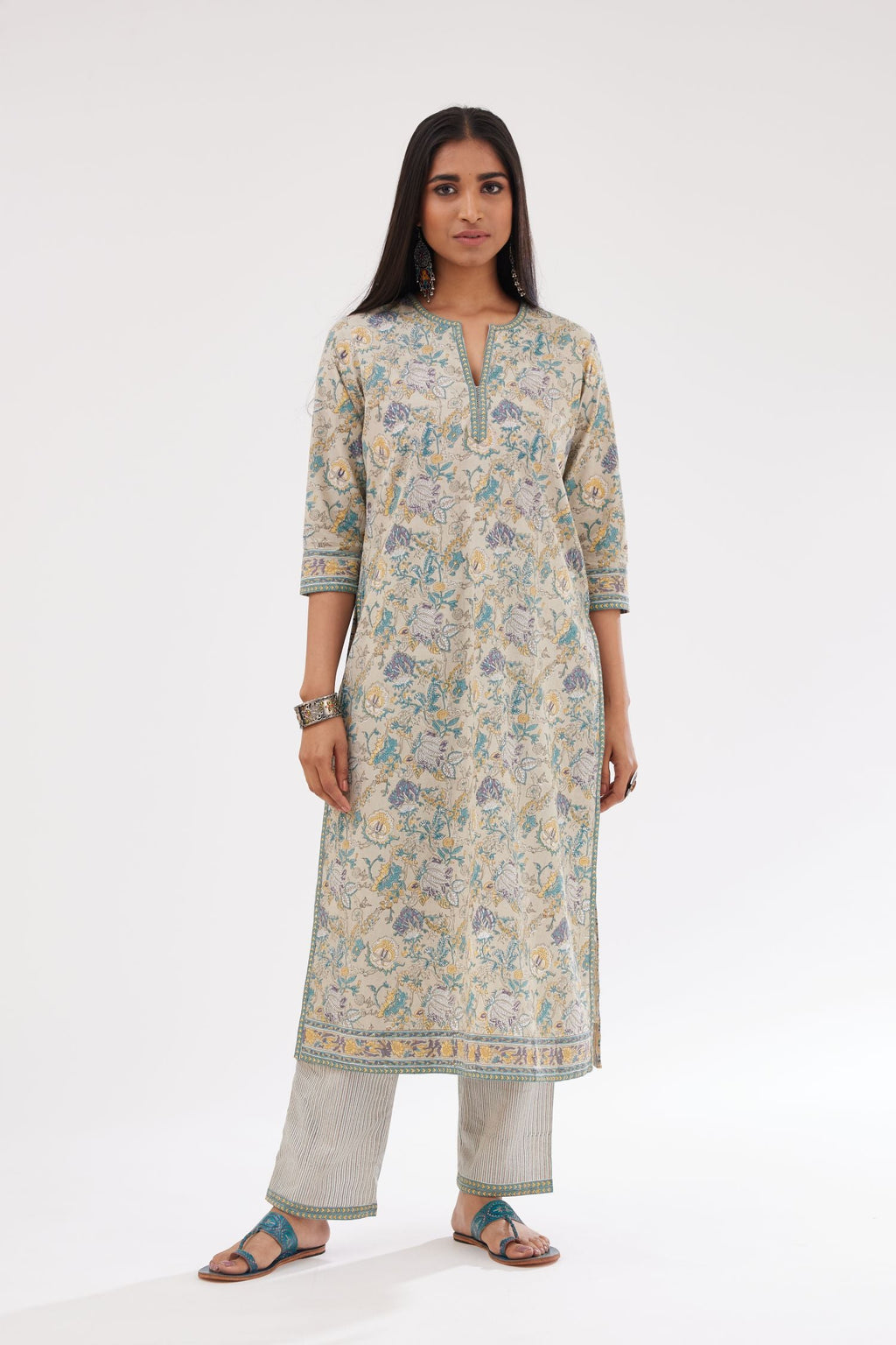 Grey and blue straight kurta with all-over chintz block print & side slits, paired with grey and blue printed stripe cotton straight pants with a narrow printed border at the hem.