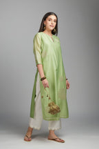 Lime green straight kurta set with gold zari embroidery in front and back.