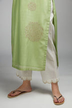 Lime green straight kurta set with gold zari embroidery in front and back.
